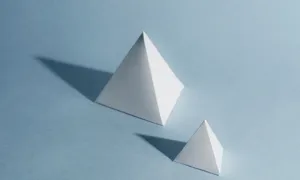 Two white pyramids of differing sizes